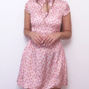 Front view of the pink floral Ayris mini dress with a Mandarin collar, keyhole neckline and short sleeves.
