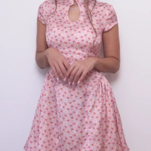 Pink floral Ayris dress showing the fitted bodice, keyhole neckline and gathered skirt at the waist.